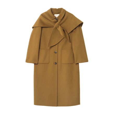 A long camel coat with a shawl detail on a white background