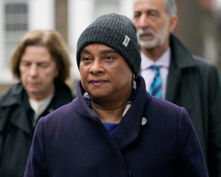 Campaigner Doreen Lawrence, with upturned collar and wearing a beany hat.