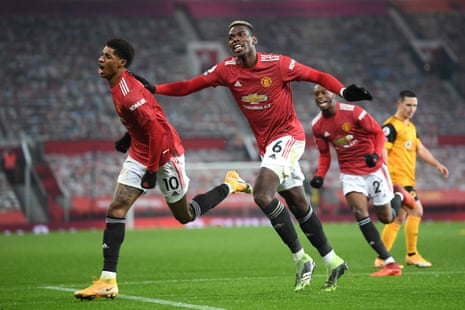 Marcus Rashford of Manchester United celebrates with teammate Paul Pogba after scoring.