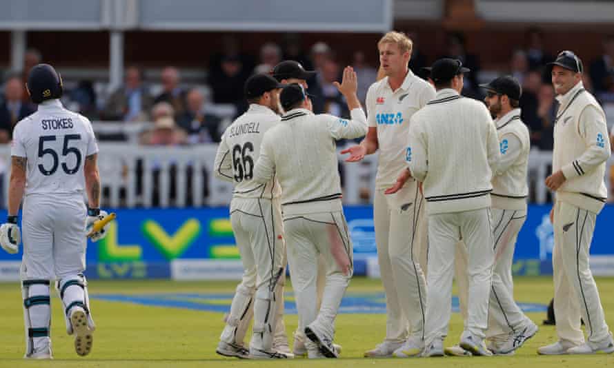 England’s Ben Stokes walks off the pitch after he is dismissal by New Zealand’s Kyle Jamieson is congratulated by his team-mates after taking Ben Stokes’ wicket on the third day of the first Test.