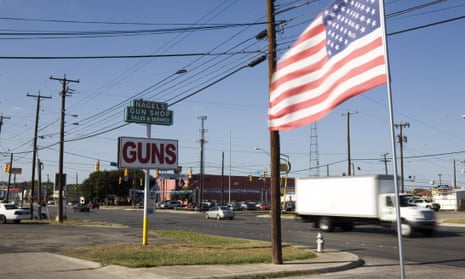 Street in San Antonio, Texas, with a sign saying 'Guns'