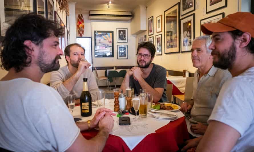 Liam, John, Blaire, Sean and Kyle Mantesso stock a repast unneurotic astatine Marios edifice successful Brunswick Street, Fitzroy
