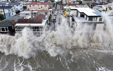 waves crashing into houses