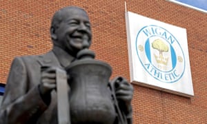 Statue of Dave Whelan with the FA Cup.