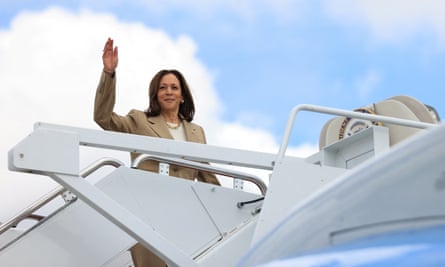 Kamala Harris waves as she boards Air Force Two