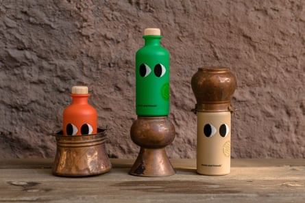 Three olive oil bottles with eyes.