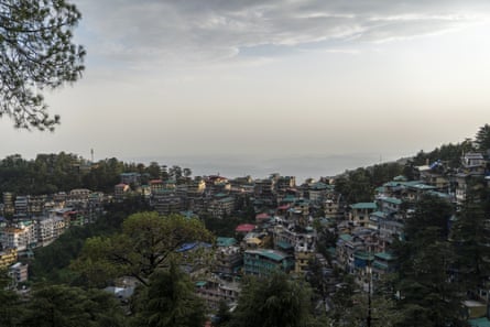 A view of multistorey building crowded onto a hillside.