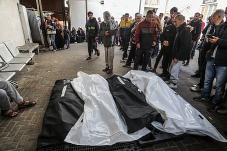 Relatives of Palestinians who lost their lives as a result of an Israeli attack mourn as they take bodies from the morgue of Abu Yousef al-Najjar hospital to be buried in Rafah on 16 April.
