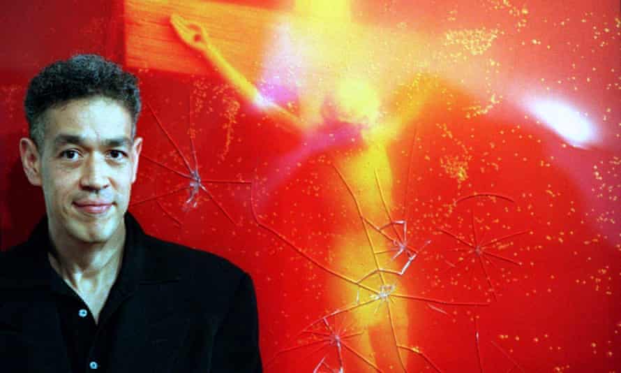 Andres Serrano in 1997 in front of his work Piss Christ after it was vandalised.