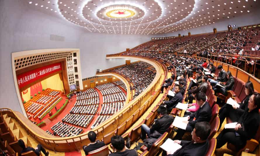 Delegates attend a session of National People’s Congress at the Great Hall of the People, where the Cultural Revolution concert was staged.