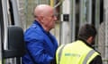 Neil Foden, a former headteacher and ex-National Education Union official, arriving at Mold crown court, Flintshire, on 22 April 2024 - accompanied by a man wearing a hi-vis jacket