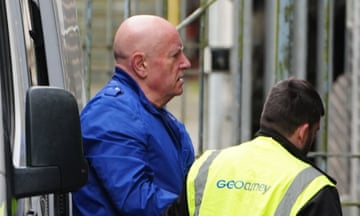Neil Foden, a former headteacher and ex-National Education Union official, arriving at Mold crown court, Flintshire, on 22 April 2024 - accompanied by a man wearing a hi-vis jacket
