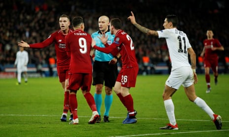 Liverpool’s Roberto Firmino, Andrew Robertson and Jordan Henderson badger referee Szymon Marciniak as Angel Di Maria protests his innocence.