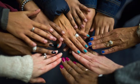 Unidentified victim of sex trafficking put their hands together in a show of solidarity at an anti-human trafficking agency in Boston, Massachusetts