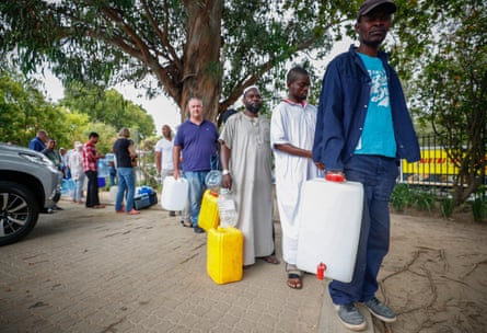 A social leveller? Cape Town residents queue to collect drinking water from a mountain spring.