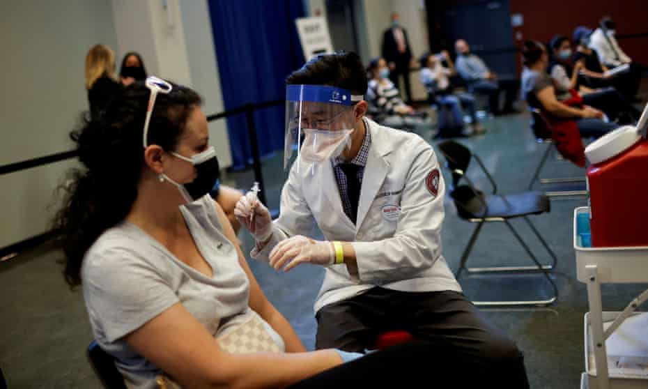 A woman receives a dose of the Johnson &amp; Johnson coronavirus vaccine in Chicago, Illinois, 6 April 2021.