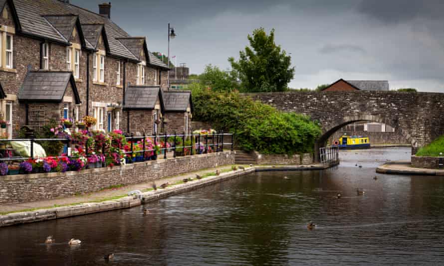 The Brecon Basin CanalEditorial BRECON, UK - JULY 26, 2020: Picturesque houses at the Brecon basin, the start of the The Monmouthshire & Brecon Canal and the Taff Trail in South Wales UK