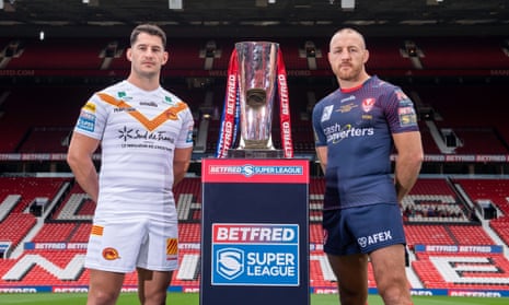 The two captains, Catalans Dragons’ Benjamin Garcia and James Roby of St Helens, pose with the trophy at Old Trafford.
