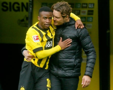 Youssoufa Moukoko celebrates with Edin Terzic after scoring for Borussia Dortmund against Union Berlin in 2023