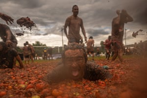 People throw tomatoes during the celebration of the 15th Colombian Tomato Festival on June 11, 2023 in Sutamarchan, Colombia.