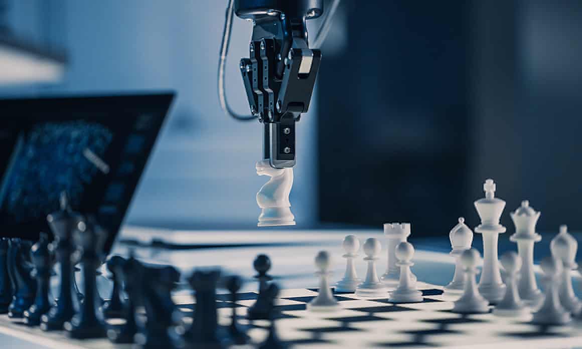 A robot arm moves a knight on a chess board