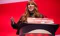 Angela Rayner speaking at the 2022 Labour conference, behind a plinth with a sign reading: 'Labour, a fairer, greener future'