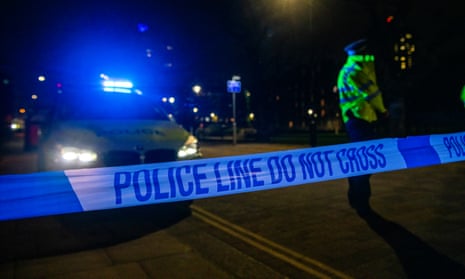 Police at night-time crime scene
