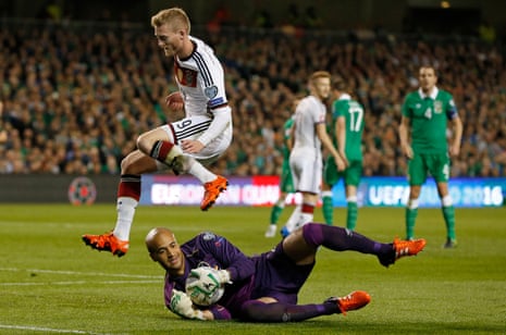Republic of Ireland’s Darren Randolph smothers the ball away from Germany’s Andre Schurrle.