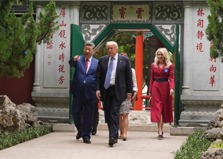 Donald Trump walks with Xi Jinping at the Zhongnanhai leadership compound.