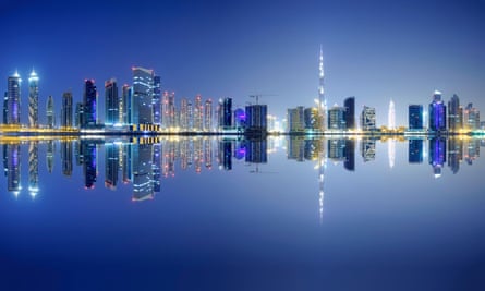 Night view of Dubai’s Business Bay district, which includes the Adrian Smith-designed Burj Khalifa.