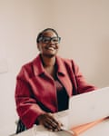 Frances Akinde, executive head teacher at St James House, pictured sitting at a laptop and smiling into the camera