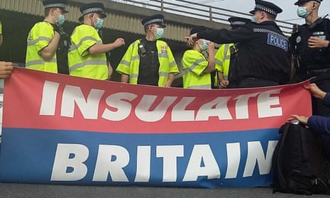 Police at the scene of an Insulate Britain protest on the M25 on 13 September 2021
