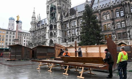 Workers dismantle Christmas market a booth in Munich