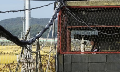 A South Korean soldier stands guard inside a military post near the border with North Korea