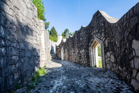 A cobbled road and walls in the park