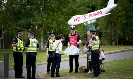 Protestors demonstrating against plans for a third Heathrow runway outside the Scottish National Party conference in Aberdeen