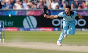 England’s Mark Wood deflects a shot by New Zealand’s Kane Williamson onto the wickte to run him out.
