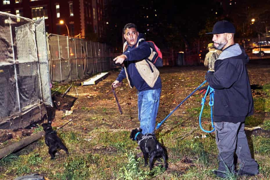 Jason River, center, and Jerry Nano, right, hunt for rats in the Lower East Side.