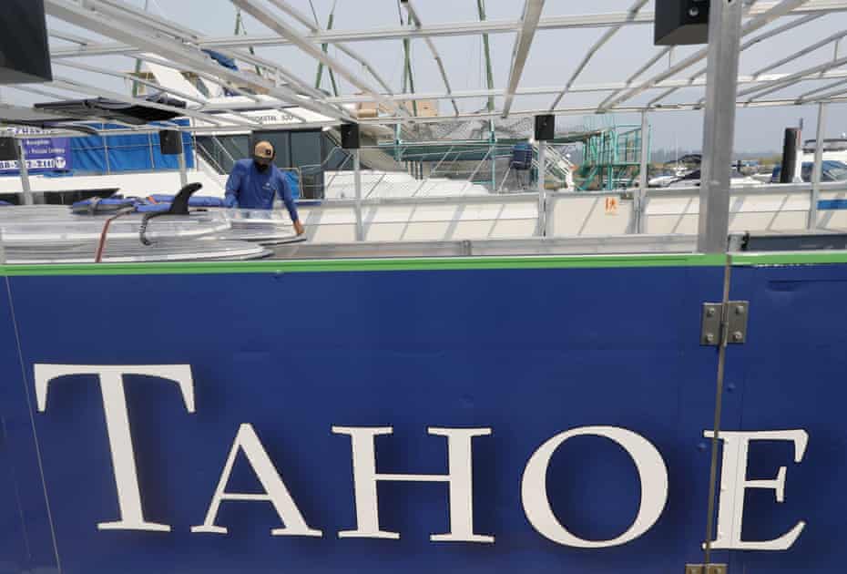 Ludovic Fekete, an employee of Clearly Tahoe, checks the company's transparent kayaks after returning from an evacuation due to a forest fire.