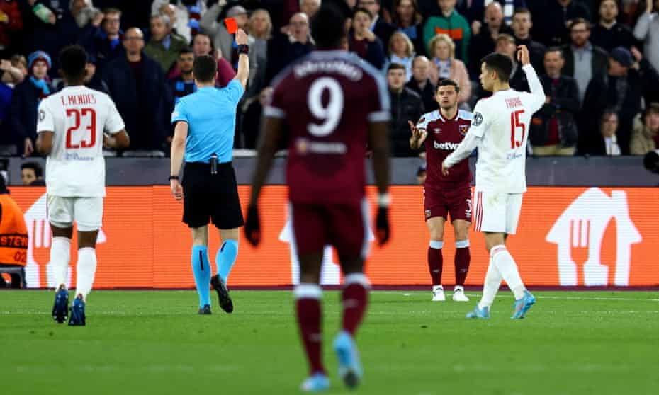 Aaron Cresswell is shown the red card late in the first half.