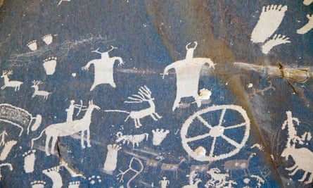 Ancient Native American rock carvings depict deers being hunted.