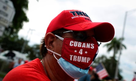 A Trump supporter attends a rally outside the ‘Latinos for Trump Roundtable’ event in Doral last month.