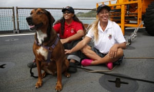 Tasha Fuiava (left) and Jennifer Appel, right, on the deck of the USS Ashland on Monday. The US navy ship arrived at the American navy base five days after it rescued the women and their dogs.
