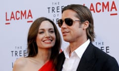 FILE PHOTO: Pitt and Jolie pose at the premiere of "The Tree of Life" at LACMA in Los Angeles<br>FILE PHOTO: Cast member Brad Pitt and actress Angelina Jolie pose at the premiere of "The Tree of Life" at LACMA in Los Angeles May 24, 2011. REUTERS/Mario Anzuoni/File Photo