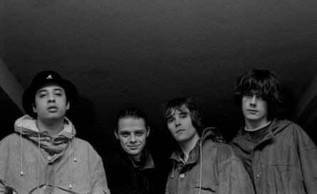 Mani (second from left) with, from left, drummer Reni, singer Ian Brown and guitarist John Squire.