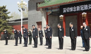 President Xi Jinping (centre left) and other Chinese leaders stand during national mourning for victims of coronavirus in Beijing on Saturday 4 April 2020