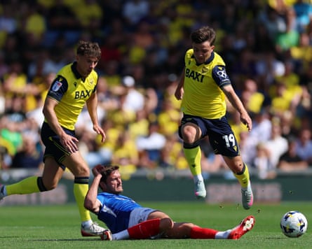 John Swift battles for the ball with Tyler Goodrham during the Championship match between Oxford and Portsmouth