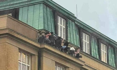 An image appearing to show students hiding from the attacker in Prague.