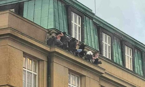 Students hiding on a ledge to escape the shooter after others were told to barricade themselves in classrooms.