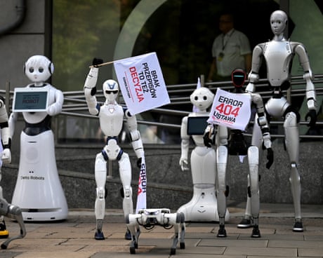 Humanoid robots hold protest signs and flags reading 'Error 404' during a demonstration in Warsaw last week